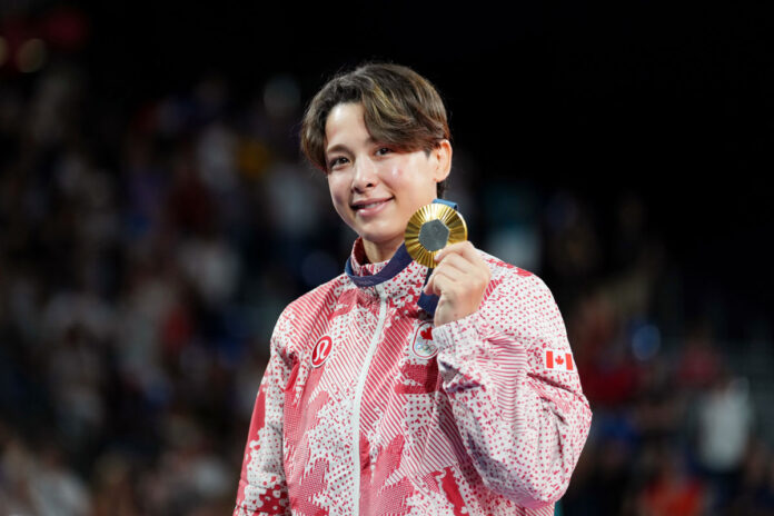 Team Canada’s Christa Deguchi poses with her gold medal in Judo 57 KG during the 2024 Paris Olympic Games in France on Monday, July 29, 2024. Photo by Darren Calabrese/COC ©2024 Canadian Olympic Committee